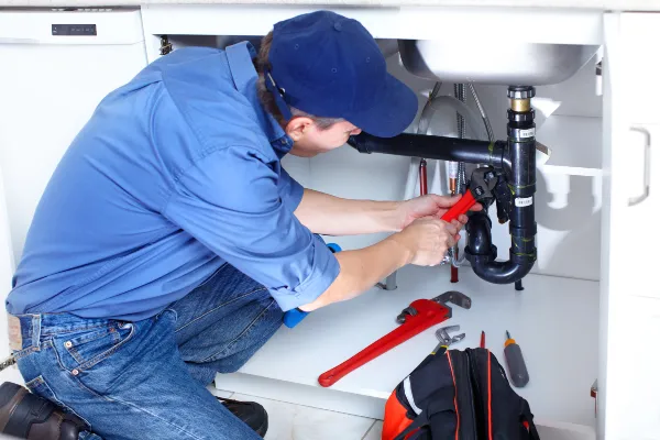 a male plumber fixing a toilet from Emergency Plumber Cedar Park in Cedar Park, TX 